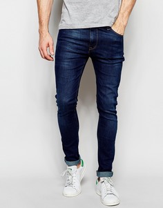 Выбеленные супероблегающие джинсы темного цвета ASOS - Синий