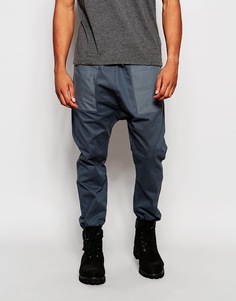 Спортивные штаны с карманами и заниженным шаговым швом ASOS - Petrol blue