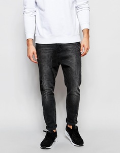 Рваные потертые джинсы черного цвета с заниженным шаговым швом ASOS - Выбеленный черный