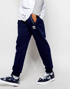 Зауженные спортивные штаны с принтом Chaos adidas Originals Superstar - Темно-синий
