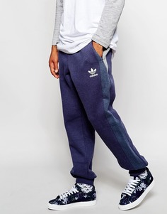 Зауженные спортивные штаны со вставками adidas Originals - Темно-синий