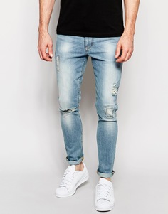 Голубые выбеленные супероблегающие джинсы с заплатками ASOS - Выбеленный синий