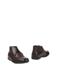 Полусапоги и высокие ботинки Tod's