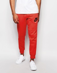 Красные спортивные брюки зауженного кроя Nike AW77 727369-672