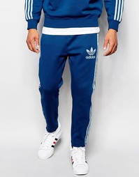 Синие спортивные штаны с фирменной отделкой adidas Originals B10670