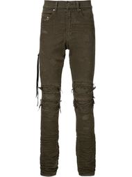 джинсы с потертой отделкой Amiri