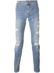 джинсы с рваными деталями Ermanno Scervino