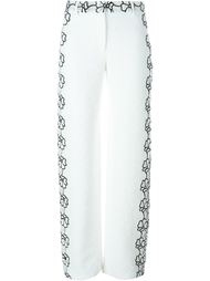 textured flower motif trousers Emanuel Ungaro