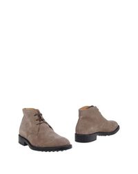 Полусапоги и высокие ботинки Tod's
