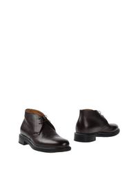 Полусапоги и высокие ботинки Santoni