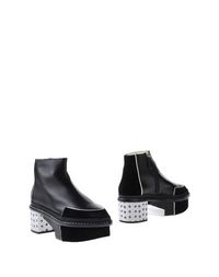Черные Полусапоги и высокие ботинки Pollini
