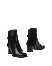 Черные Полусапоги и высокие ботинки Stuart Weitzman