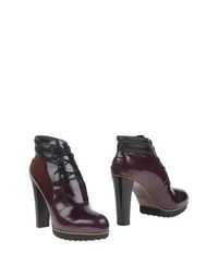 Полусапоги и высокие ботинки Tod's