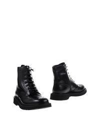 Полусапоги и высокие ботинки Prada