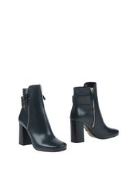 Полусапоги и высокие ботинки Prada