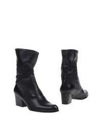 Черные Полусапоги и высокие ботинки Stuart Weitzman