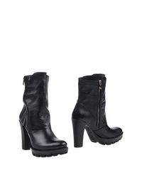Черные Полусапоги и высокие ботинки Versace 19•69