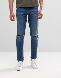 Синие выбеленные узкие джинсы стретч с рваными коленками ASOS