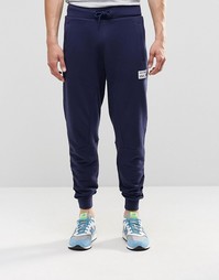 Темно-синие спортивные брюки New Balance EMP53709 - Темно-синий