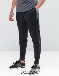 Черные зауженные спортивные брюки New Balance MP61562 - Черный