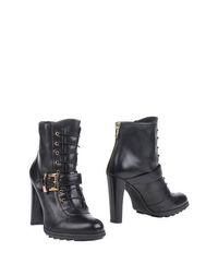Черные Полусапоги и высокие ботинки Stuart Weitzman
