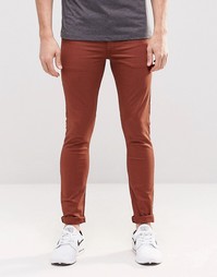 Красно-бурые супероблегающие джинсы ASOS - Коричневый