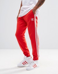 Спортивные штаны с манжетами adidas Originals AY7703 - Красный