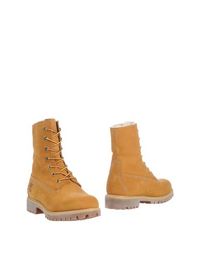 Полусапоги и высокие ботинки Timberland