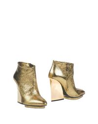 Золотистые Полусапоги и высокие ботинки Roberto Cavalli