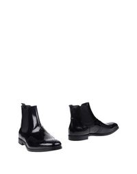 Полусапоги и высокие ботинки Prada