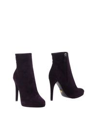 Полусапоги и высокие ботинки Prada