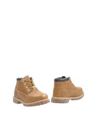 Коричневые Полусапоги и высокие ботинки Timberland