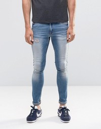 Выбеленные супероблегающие джинсы с потертостями ASOS - Светло-голубой