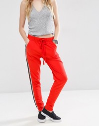 Джоггеры с контрастными полосками по бокам ASOS - Красный