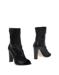 Черные Полусапоги и высокие ботинки Stuart Weitzman