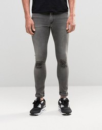 Серые супероблегающие джинсы с рваными коленками ASOS - Серый