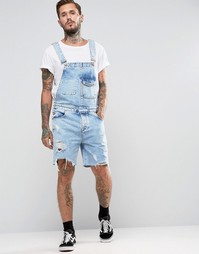Рваный джинсовый комбинезон с эффектом кислотной стирки ASOS - Синий
