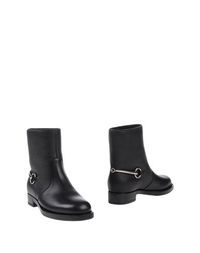 Полусапоги и высокие ботинки Gucci