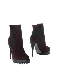 Полусапоги и высокие ботинки Casadei