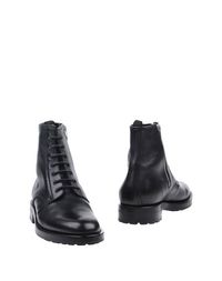 Полусапоги и высокие ботинки Saint Laurent