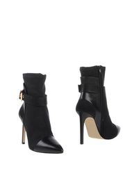Полусапоги и высокие ботинки Guess