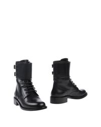 Полусапоги и высокие ботинки Saint Laurent
