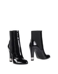 Полусапоги и высокие ботинки Casadei