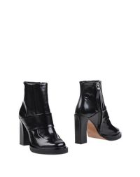 Полусапоги и высокие ботинки Carven