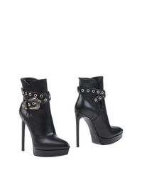 Полусапоги и высокие ботинки Saint Laurent