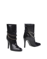 Полусапоги и высокие ботинки Saint Laurent