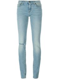 джинсы с потертой отделкой Saint Laurent