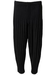 плиссированные зауженные к низу брюки Homme Plissé Issey Miyake