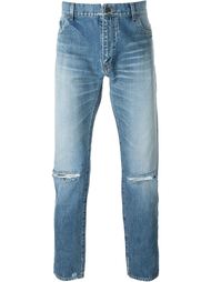 джинсы с прорезями на коленях Saint Laurent