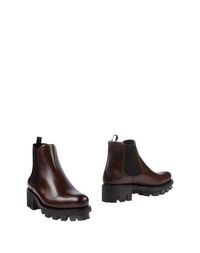 Полусапоги и высокие ботинки Prada